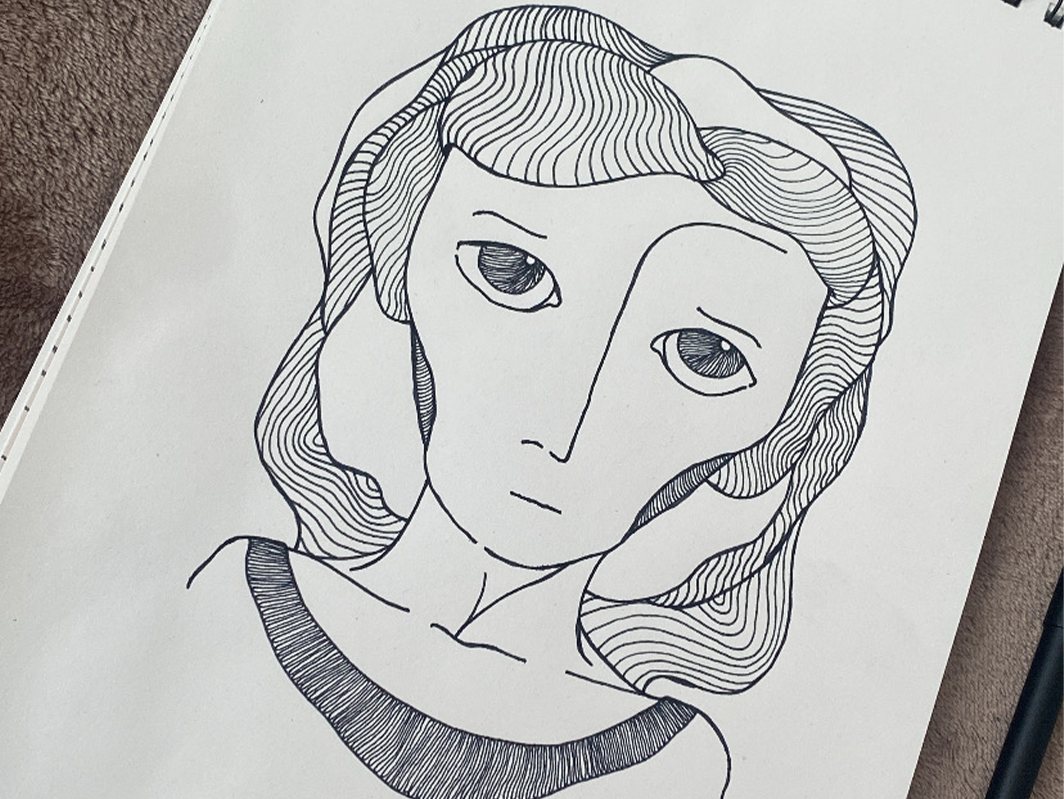 Black ink drawing of a woman with wavy hair drawn in fine parallel lines and large eyes, on a sketchbook page.
